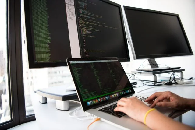 IT engineer reviewing Linux server security hardening settings in a data center server room